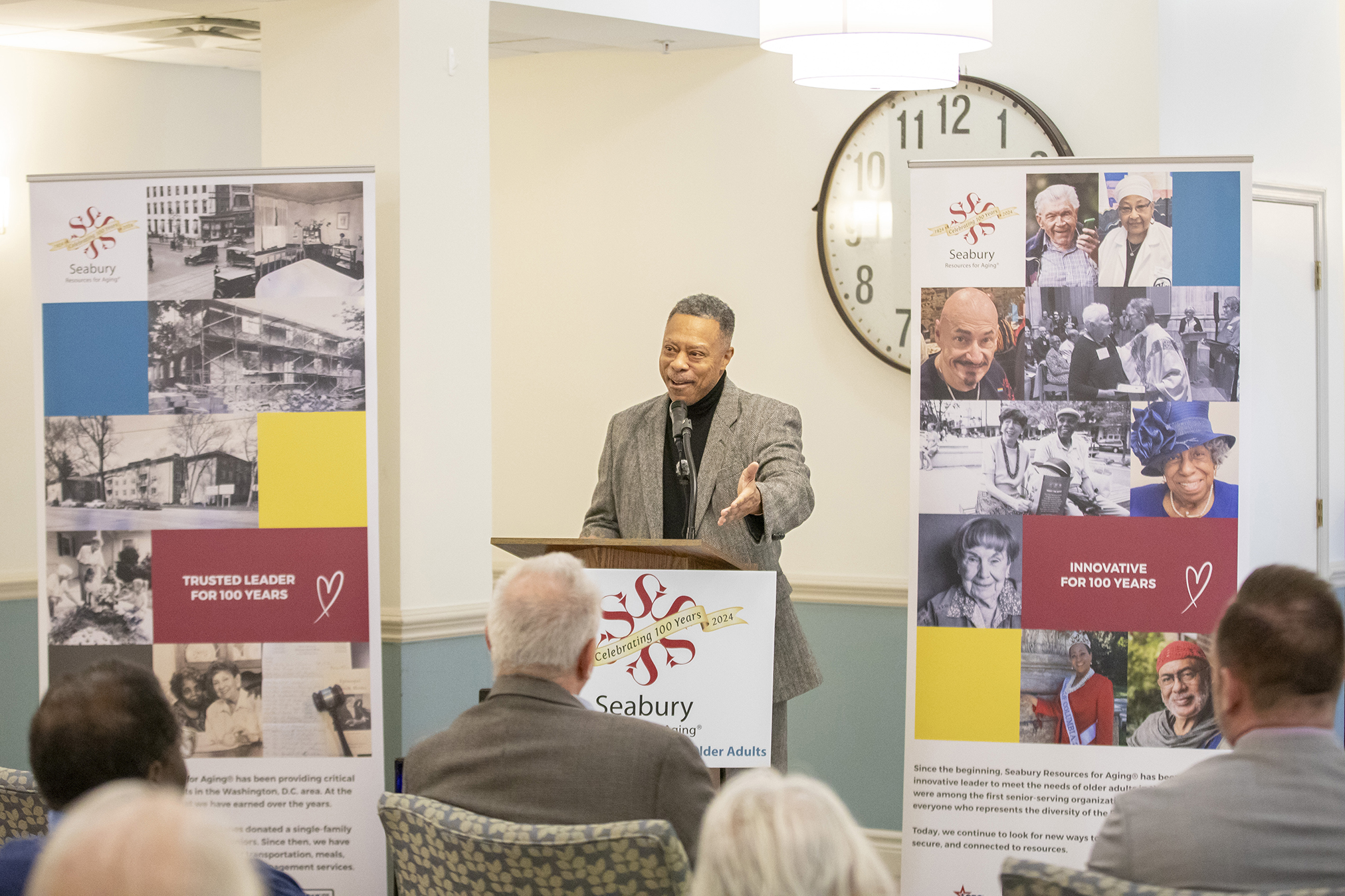 DCHA Executive Director Keith Pettigrew speaks to guests during the Friendship Terrace Open House.
