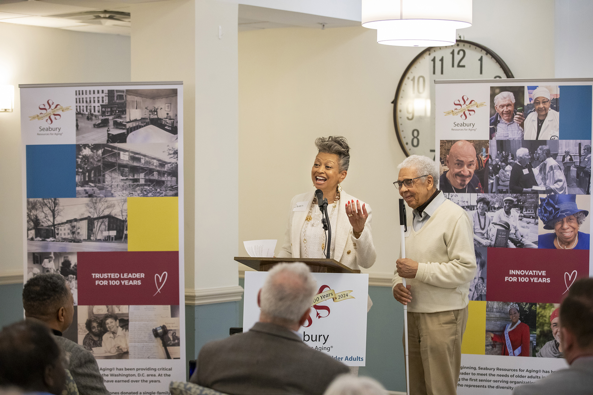 Senior resident speaks with DCHA and Seabury representatives during the Friendship Terrace Open House.