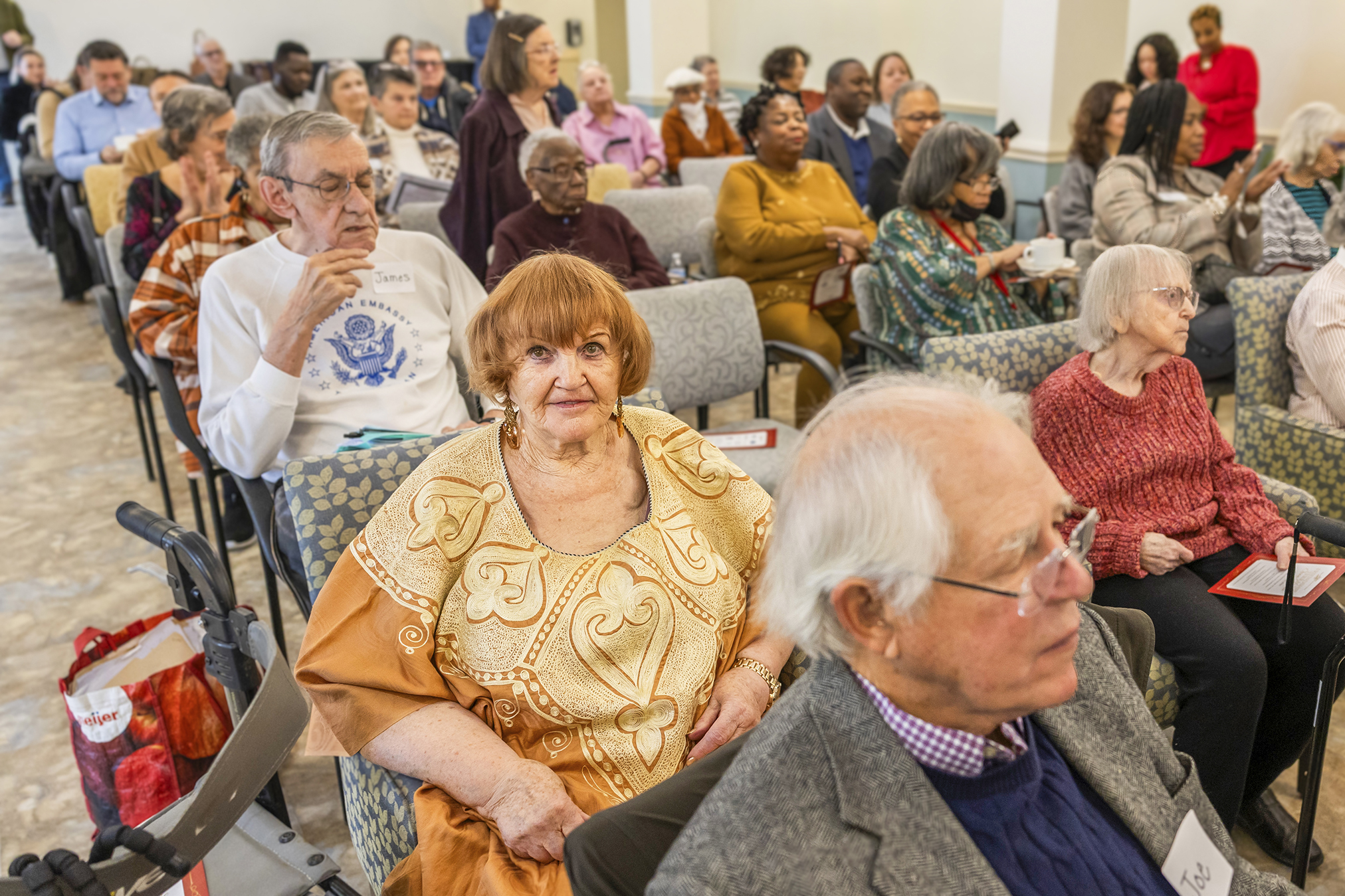 Friendship Terrace senior residents and guests gather during the Open House celebrating the community’s renovations and affordable housing preservation.