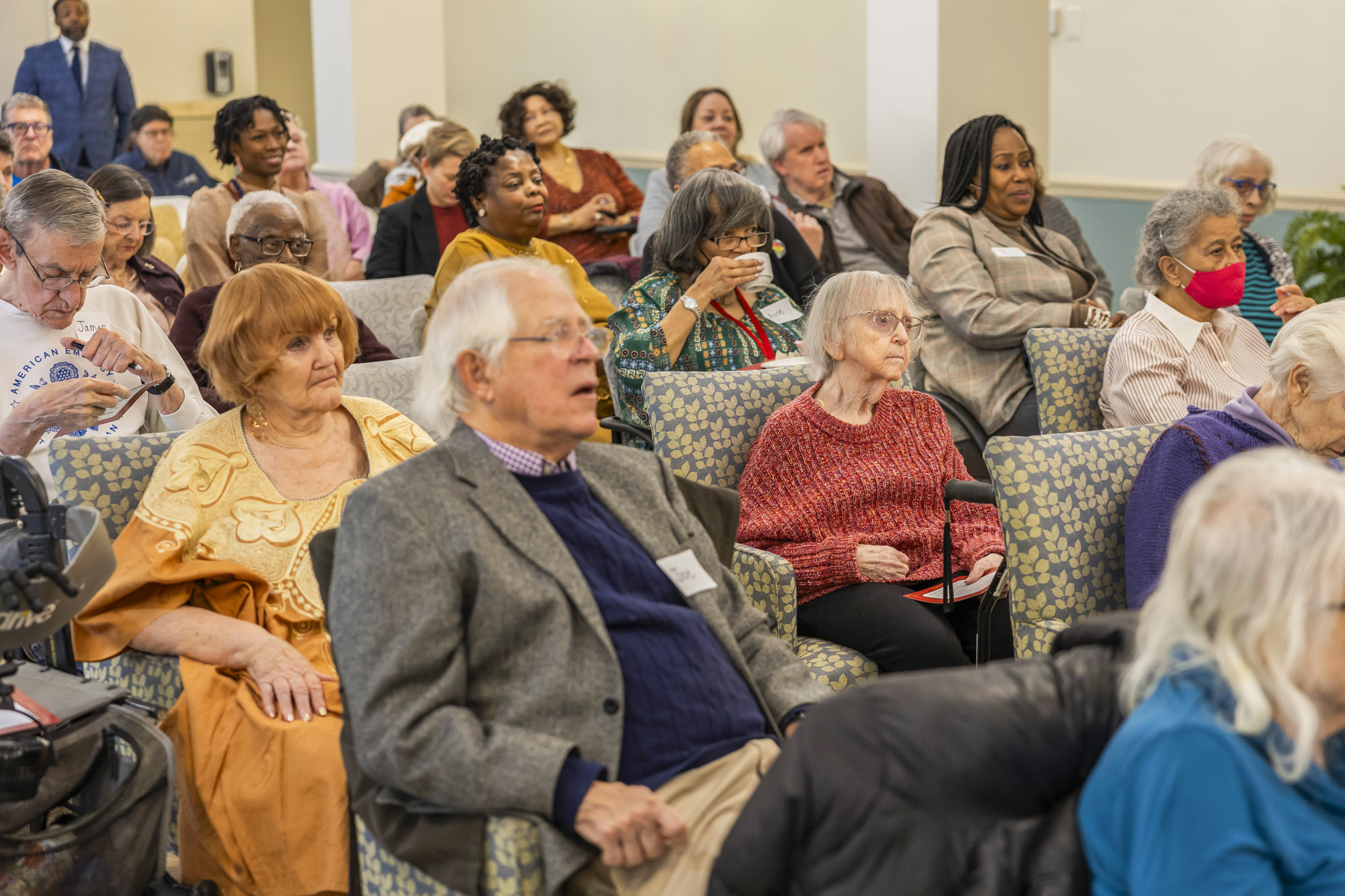 Friendship Terrace senior residents and guests gather during the Open House celebrating the community’s renovations and affordable housing preservation.