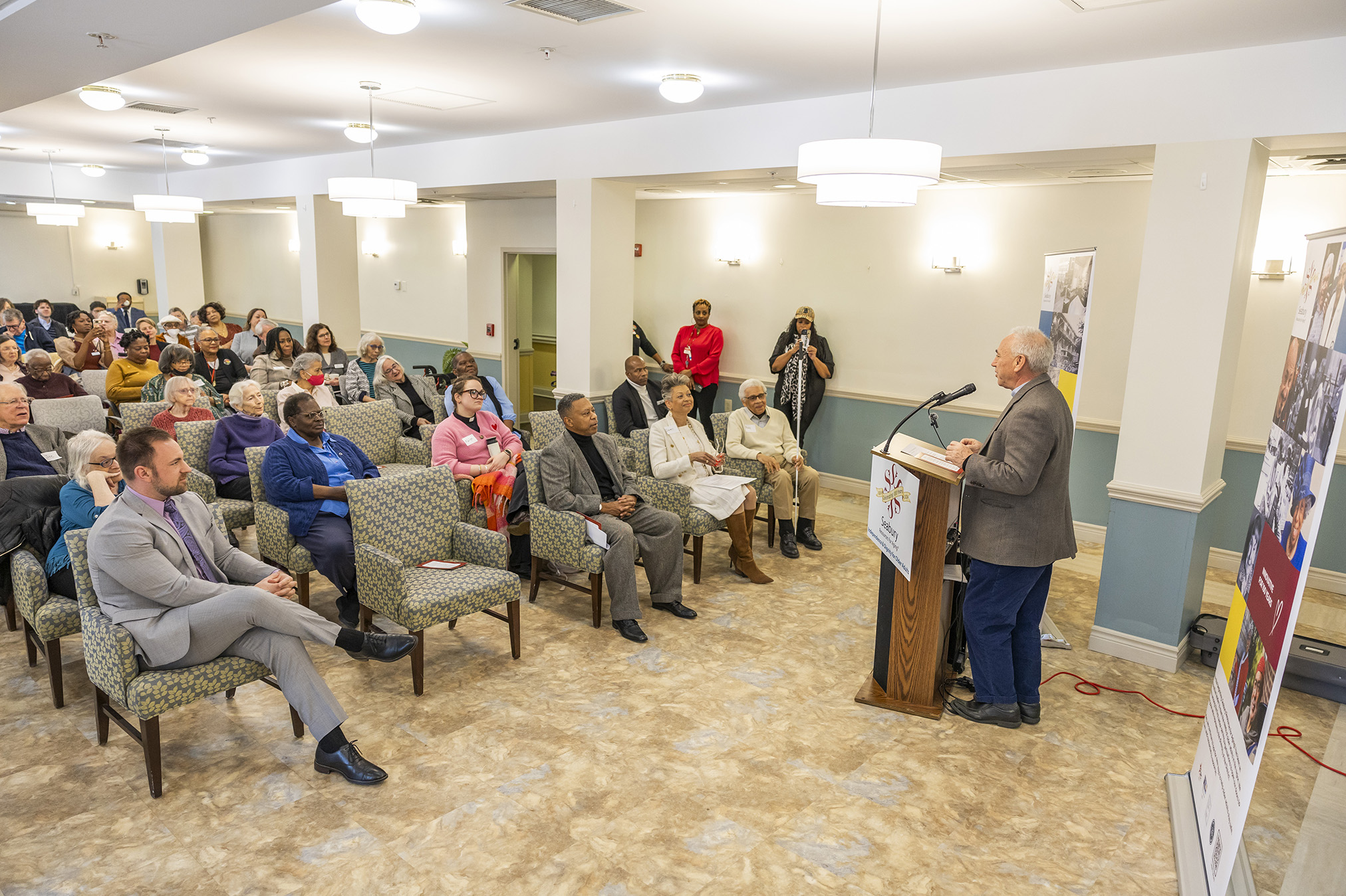 Friendship Terrace senior residents and guests gather during the Open House celebrating the community’s renovations and affordable housing preservation.