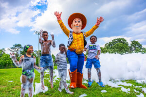 Approximately 250 residents, families and friends from the neighborhood enjoyed bounce houses, a water slide, foam bubbles, various games, face painting, food, live music and more. Children in attendance were thrilled to see Woody from the Toy Story movies at the party. Attendees were able to connect and enjoy the day together, further strengthening community bonds.