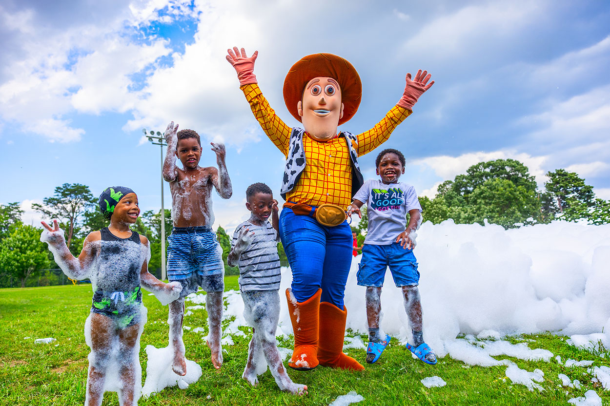 Approximately 250 residents, families and friends from the neighborhood enjoyed bounce houses, a water slide, foam bubbles, various games, face painting, food, live music and more. Children in attendance were thrilled to see Woody from the Toy Story movies at the party. Attendees were able to connect and enjoy the day together, further strengthening community bonds.
