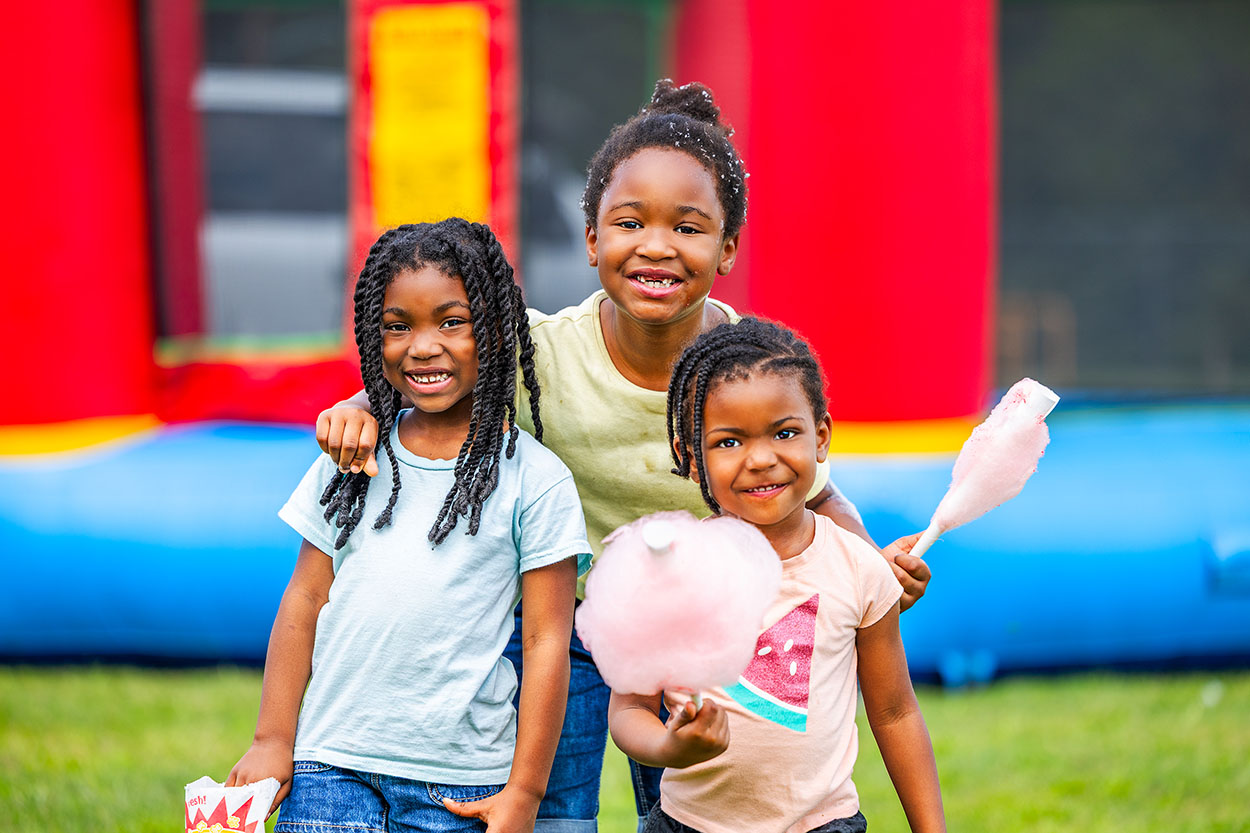 Approximately 250 residents, families and friends from the neighborhood enjoyed bounce houses, a water slide, foam bubbles, various games, face painting, food, live music and more. Children in attendance were thrilled to see Woody from the Toy Story movies at the party. Attendees were able to connect and enjoy the day together, further strengthening community bonds.