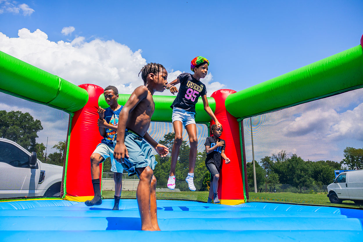 Approximately 250 residents, families and friends from the neighborhood enjoyed bounce houses, a water slide, foam bubbles, various games, face painting, food, live music and more. Children in attendance were thrilled to see Woody from the Toy Story movies at the party. Attendees were able to connect and enjoy the day together, further strengthening community bonds.