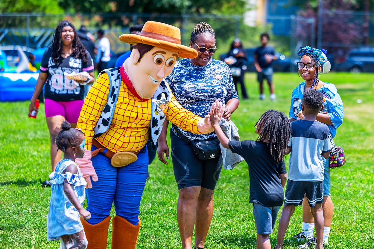 Approximately 250 residents, families and friends from the neighborhood enjoyed bounce houses, a water slide, foam bubbles, various games, face painting, food, live music and more. Children in attendance were thrilled to see Woody from the Toy Story movies at the party. Attendees were able to connect and enjoy the day together, further strengthening community bonds.