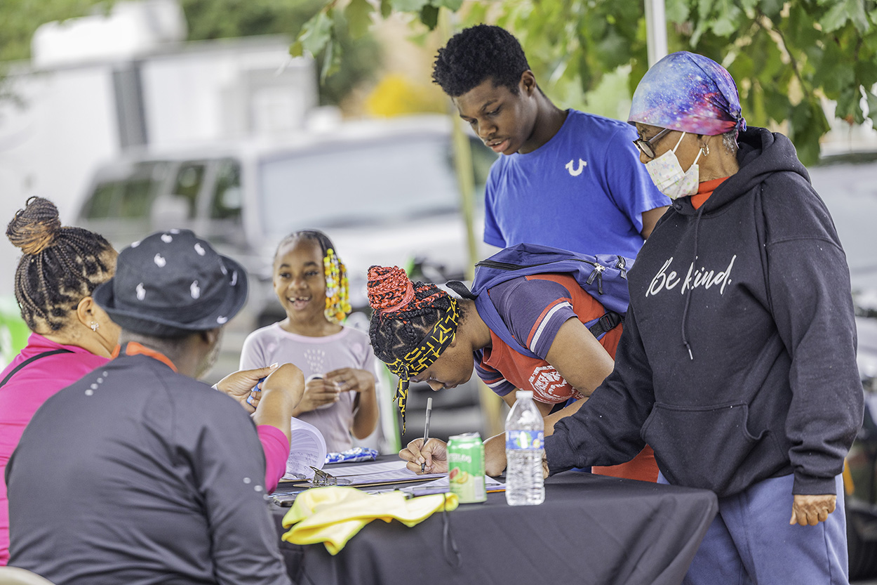 More than 170 people braved the rain to join DCHA staff for a fun-filled day with their family, friends and neighbors. Partygoers enjoyed food, live music, games, face painting, bounce houses and more. The block party also allowed people to connect and strengthen community bonds. 