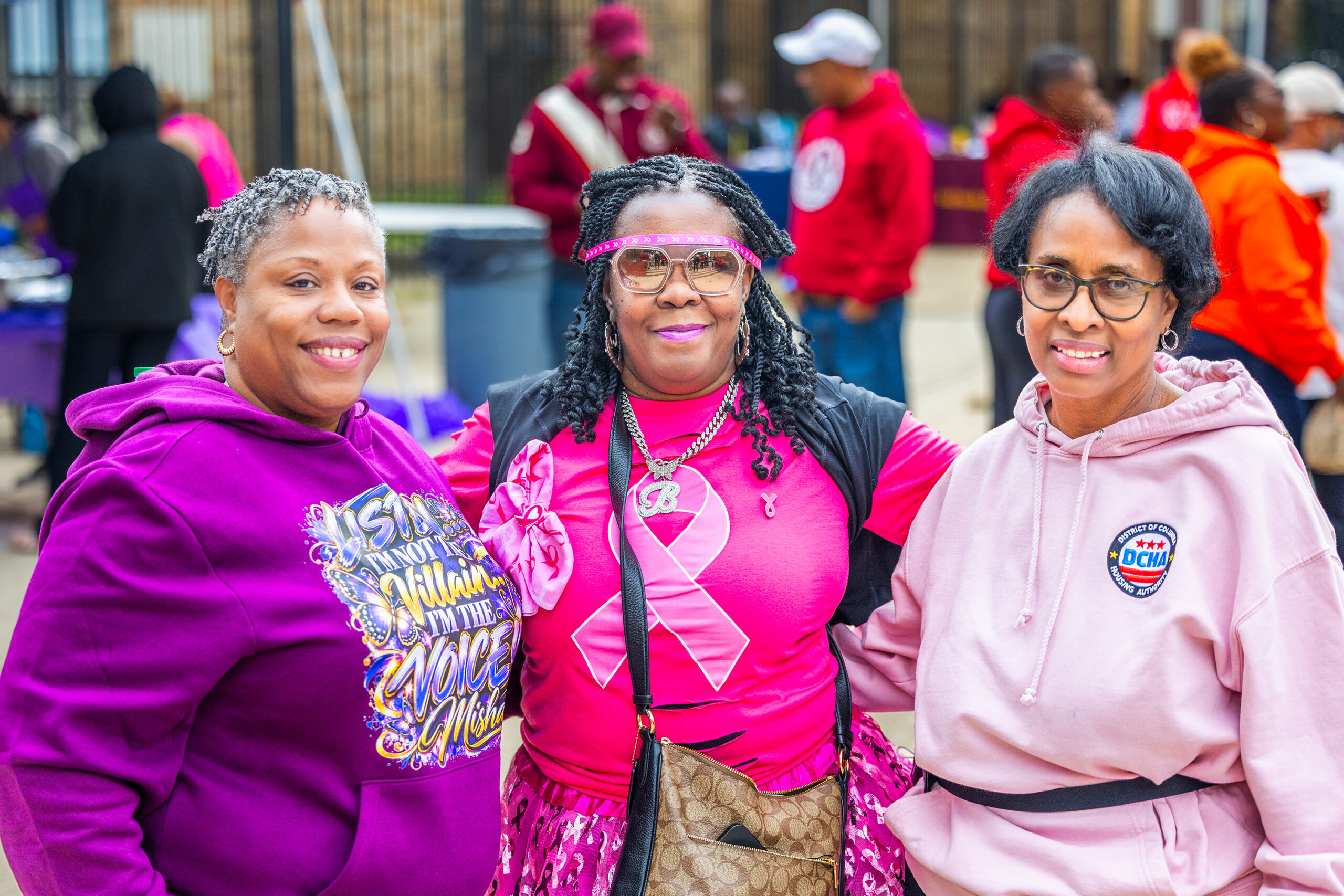 DCHA's staff smile for a group photo at the Potomac Gardens community event.